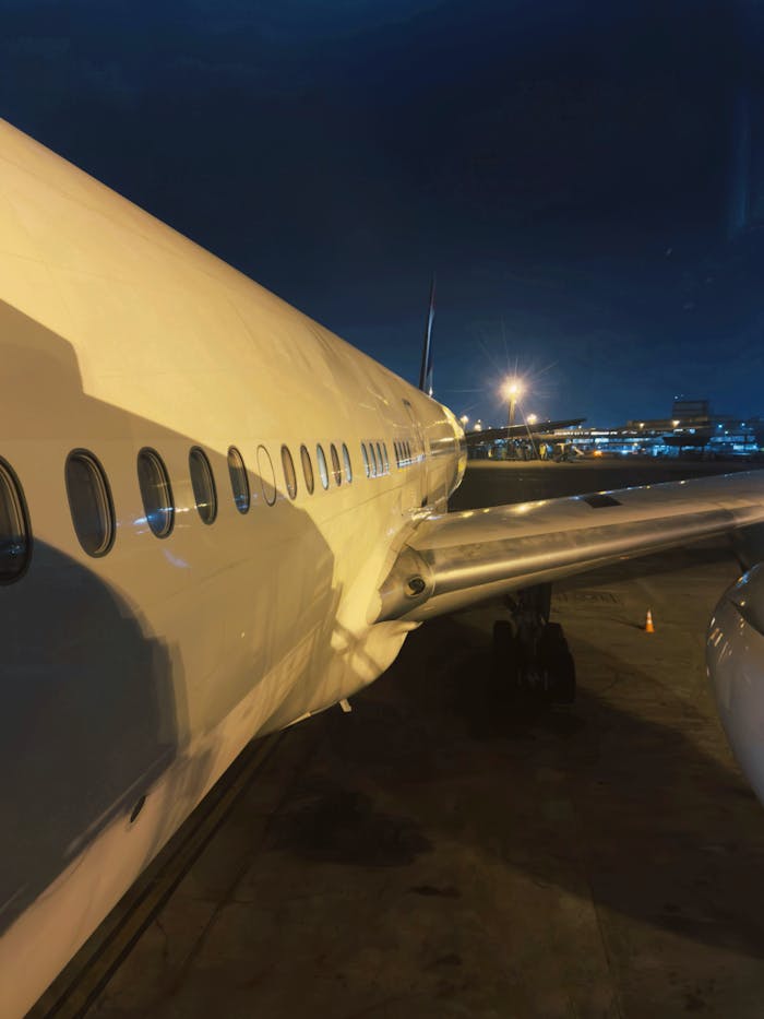 Aircraft Wing at Night Airport Terminal